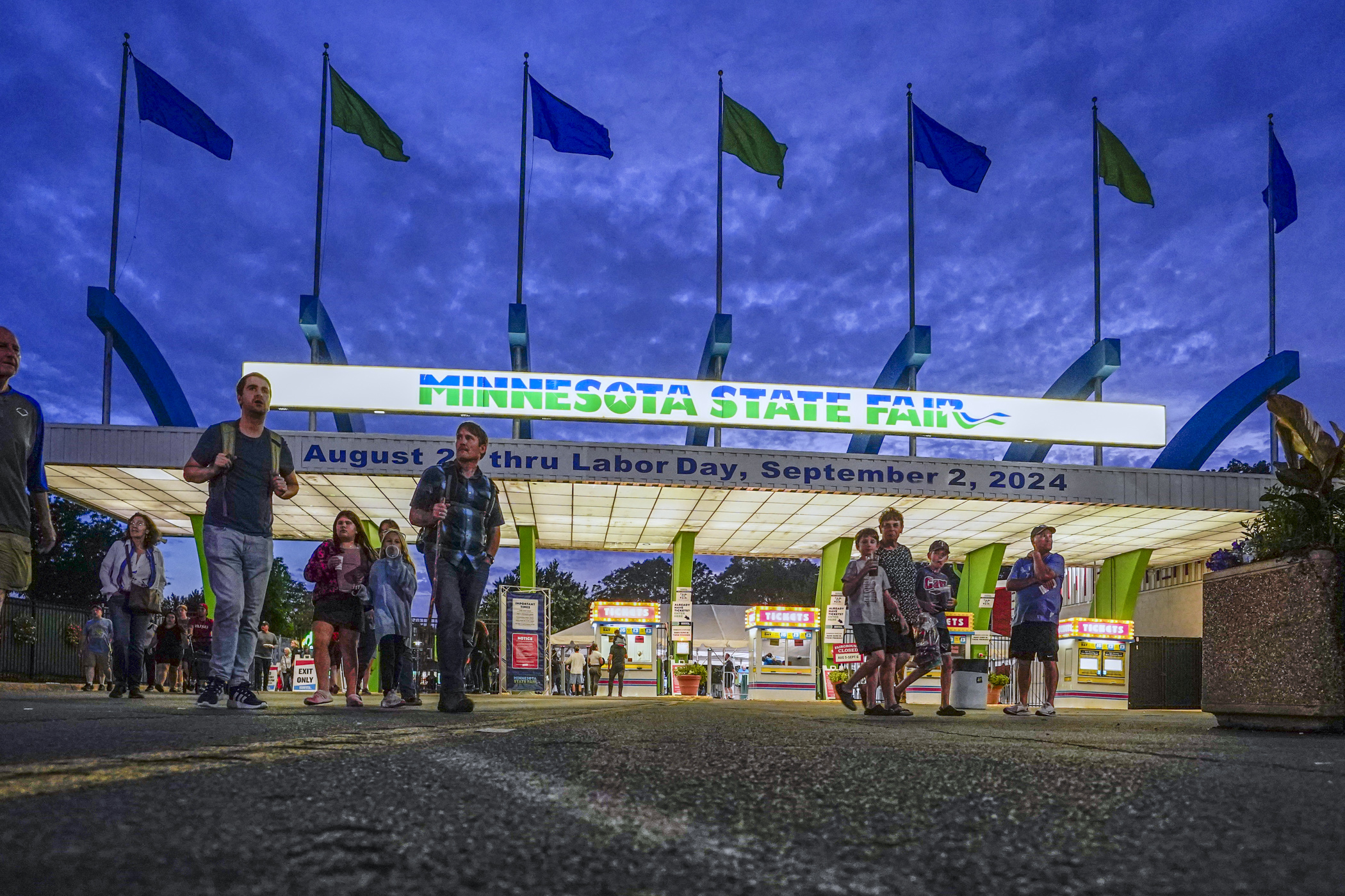 Fairgoers gather near the Minnesota State Fair's front gate along Snelling Ave. Aug. 22. (Photo by Michele Jokinen)